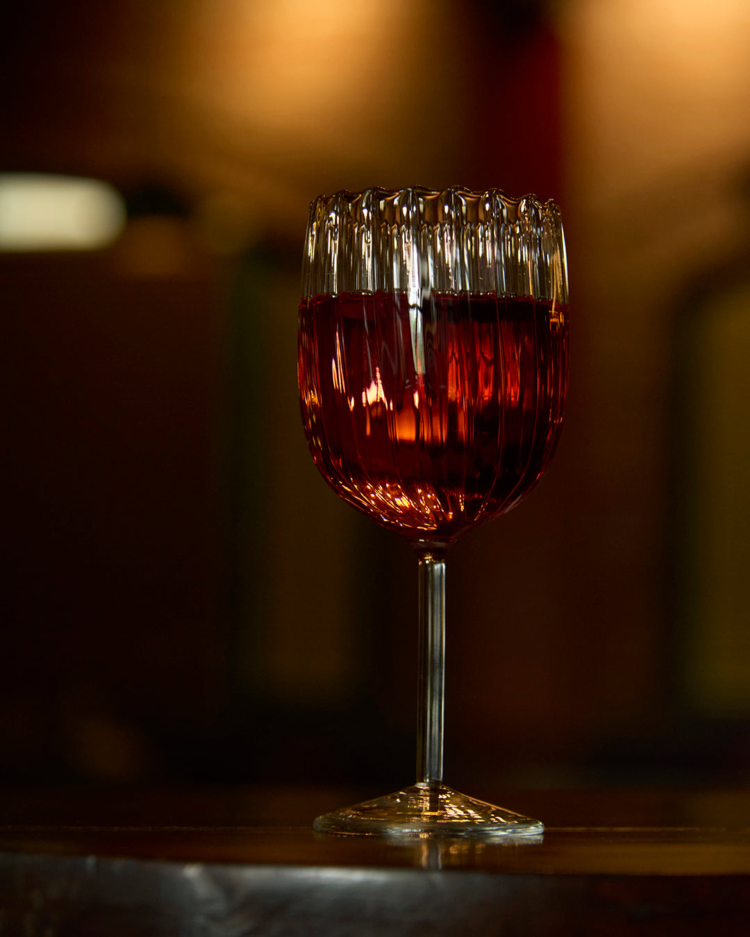 Ribbed pristine fluted wine glass elegant textured clear glassware Wine served in ribbed fluted glass Premium clear glass ribbed fluted wine glass durable stemware