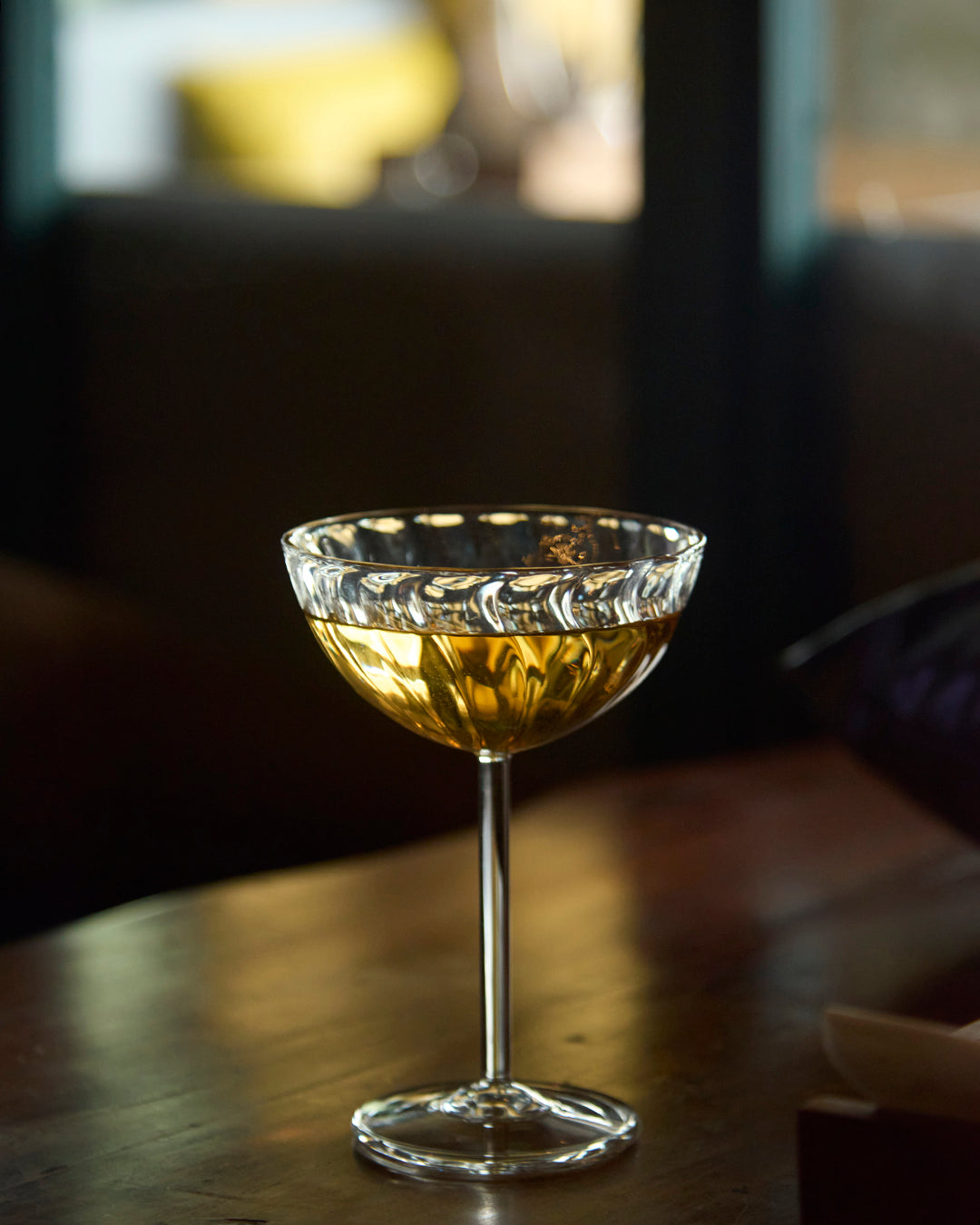 Twist and sip fluted scoop glass with twisted ribbed design clear glassware Dessert served in twisted fluted scoop glass Premium clear glass fluted scoop with twisted rib texture