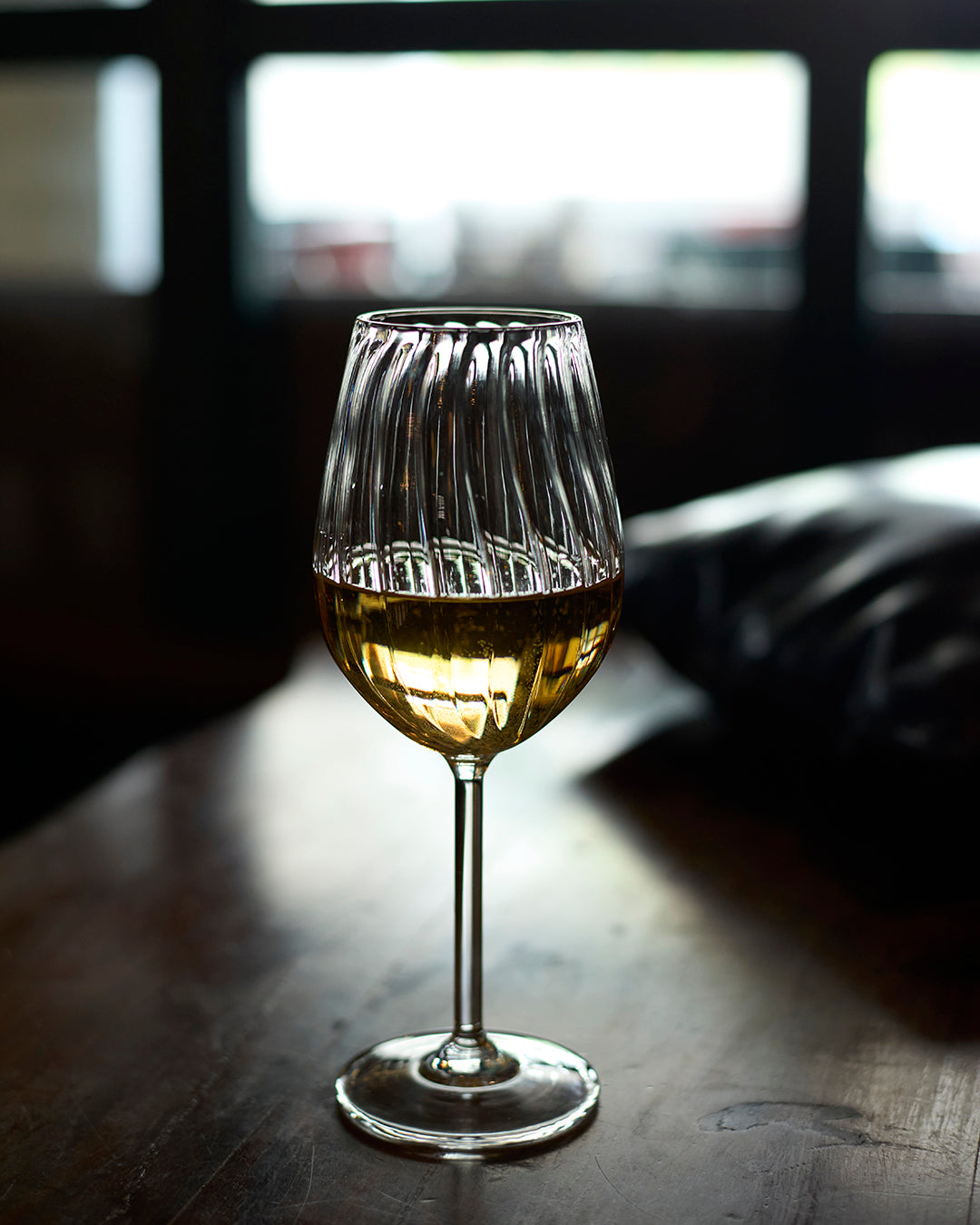 Bubbly bliss fluted wine glass elegant ribbed clear glassware Ribbed wine glass for home entertaining and special occasions High clarity ribbed wine glass with elegant fluted design