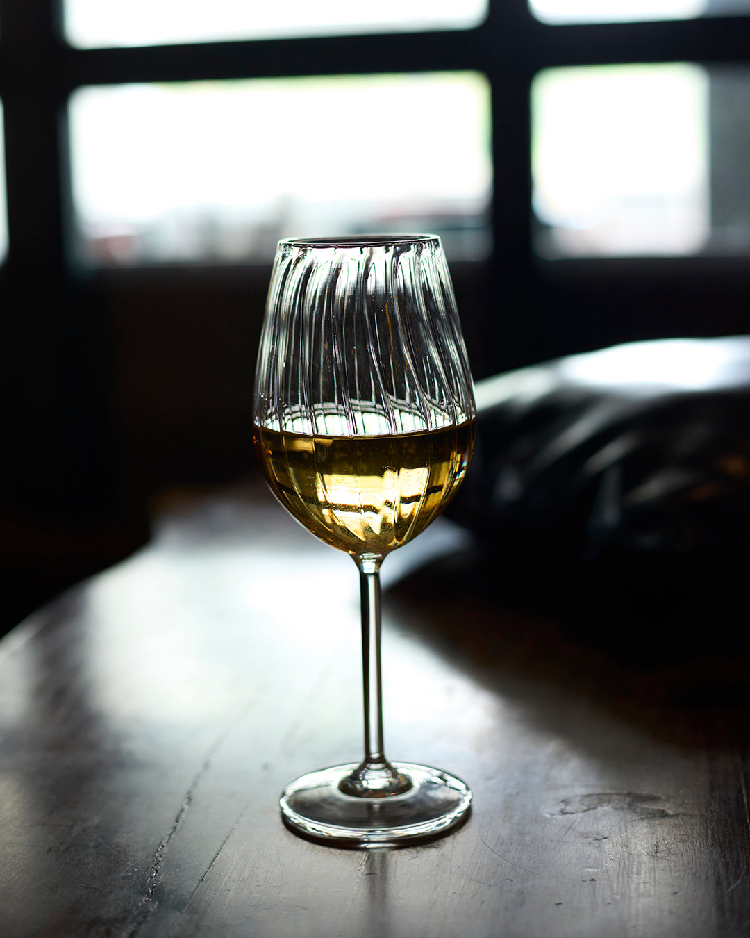 Bubbly bliss fluted wine glass elegant ribbed clear glassware Ribbed wine glass for home entertaining and special occasions High clarity ribbed wine glass with elegant fluted design