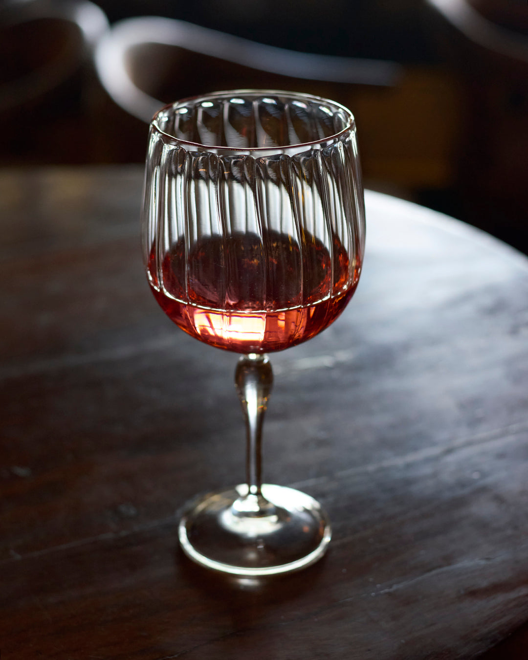 Vintage curves fluted mocktail glass elegant clear glass drinkware Elegant fluted glass for mocktails cocktails and cold beverages Decorative curved fluted glass for stylish drink presentation Elegant vintage mocktail drinkware