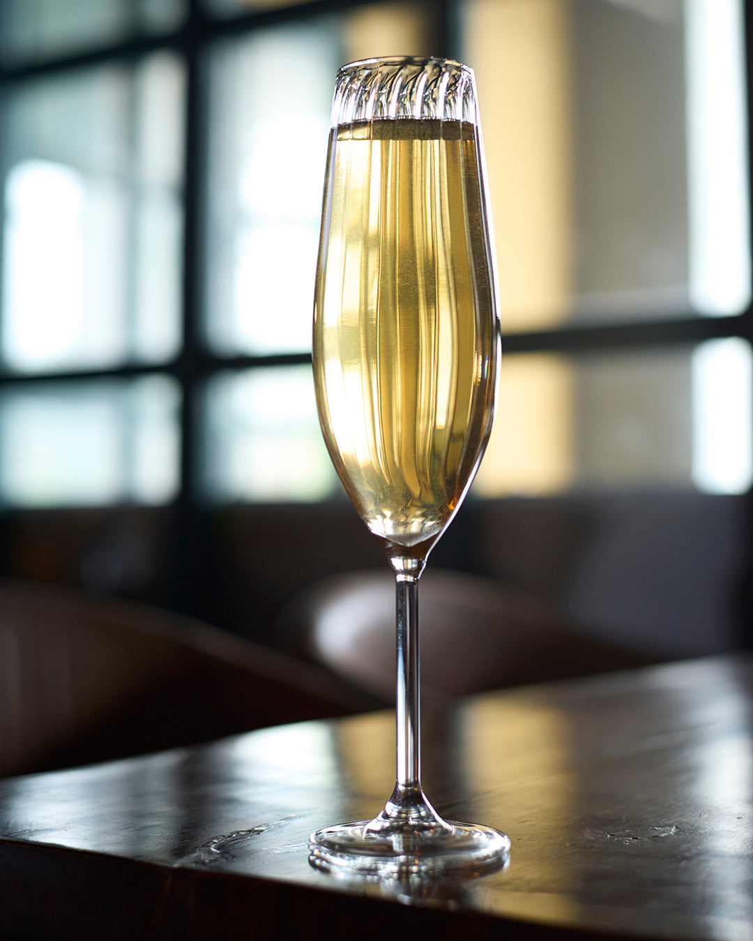 Classic flute glass for champagne prosecco and sparkling wine Champagne served in classic clear flute glass Tall stem classic flute glass with narrow bowl design Classic champagne flute glass