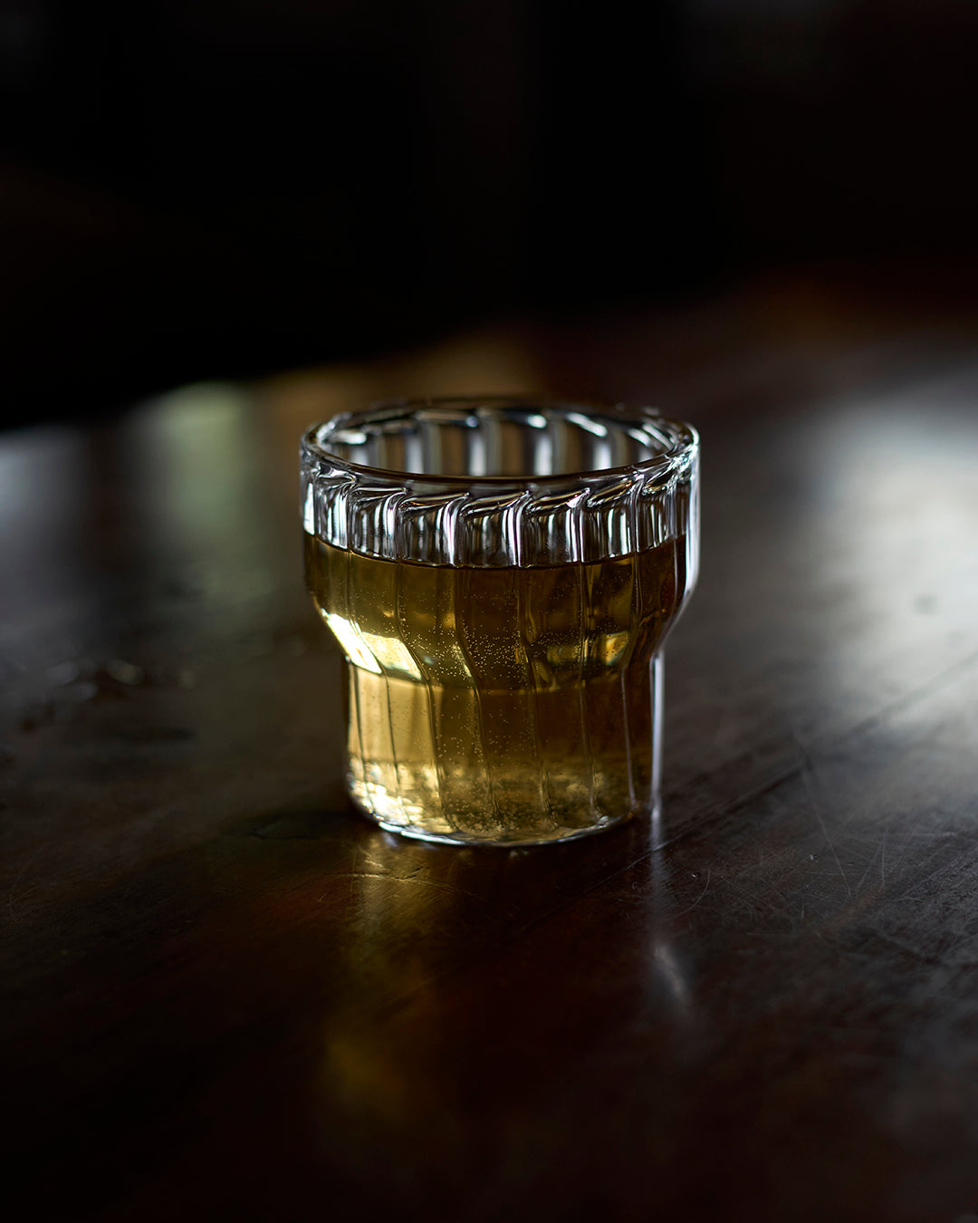 Fluted water glass on modern dining table contour fluted water glass luxury water glass for dining handmade fluted water glass